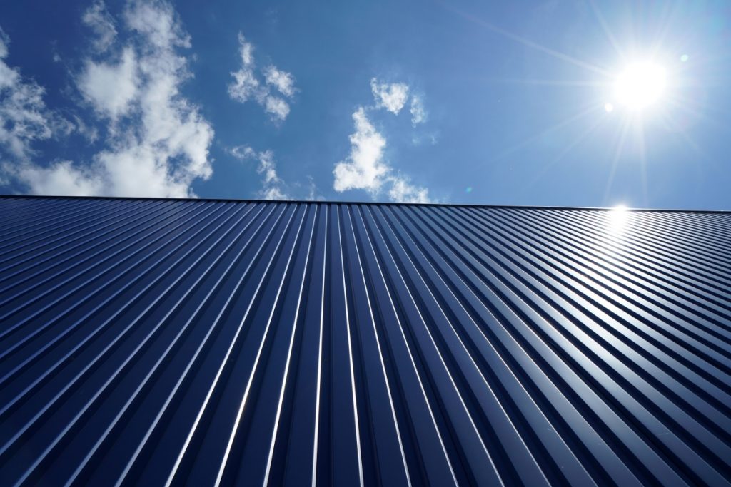 Standing seam metal roof installation on a commercial building in Jacksonville, Florida